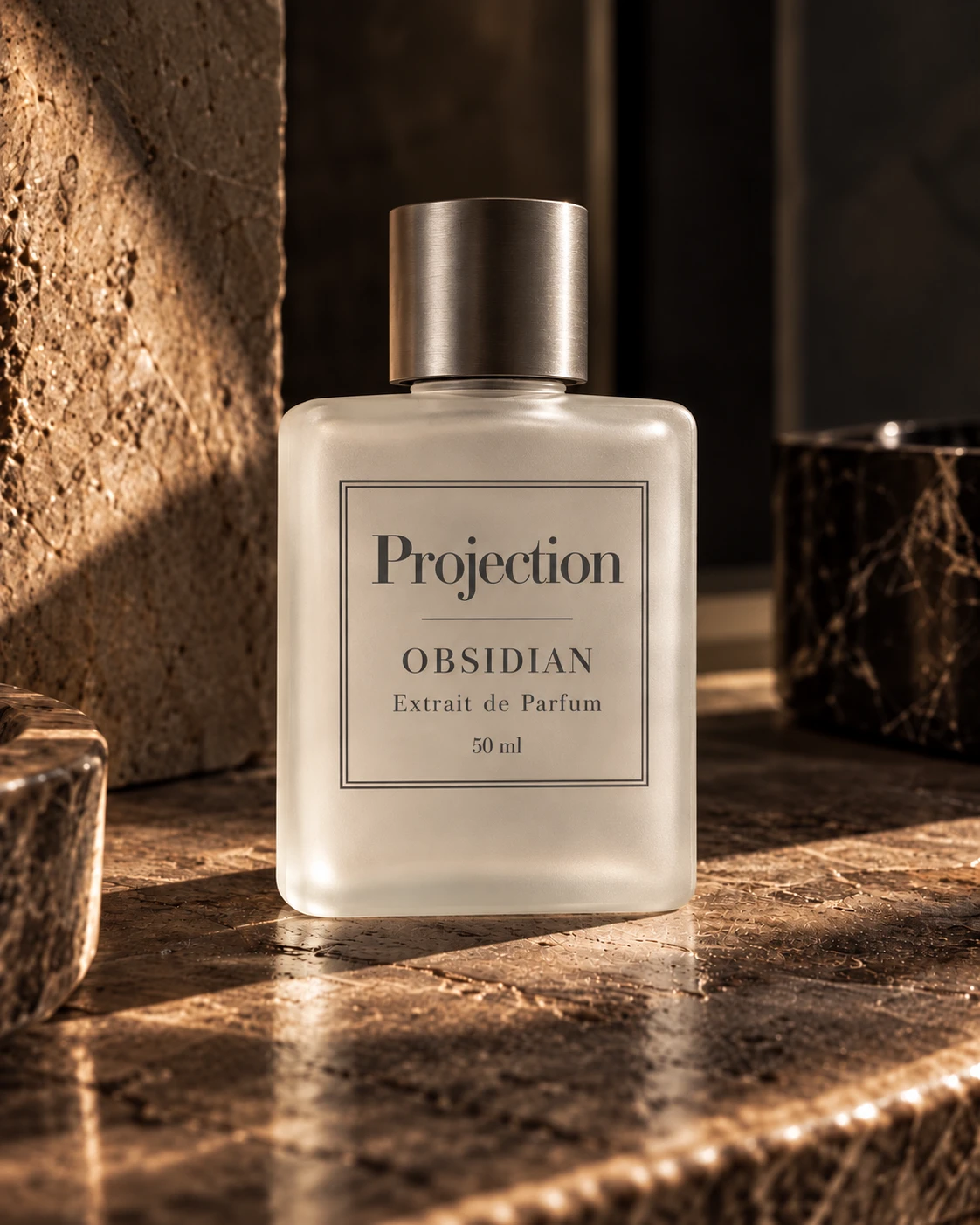 Supplied PROJECTION Obsidian bottle image: frosted glass, steel-grey lid and grey lettering